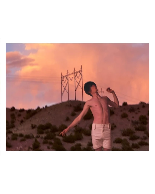 A slender person stands against a desert hillside at sunset, wearing white shorts, with transmission towers on the ridge behind them.