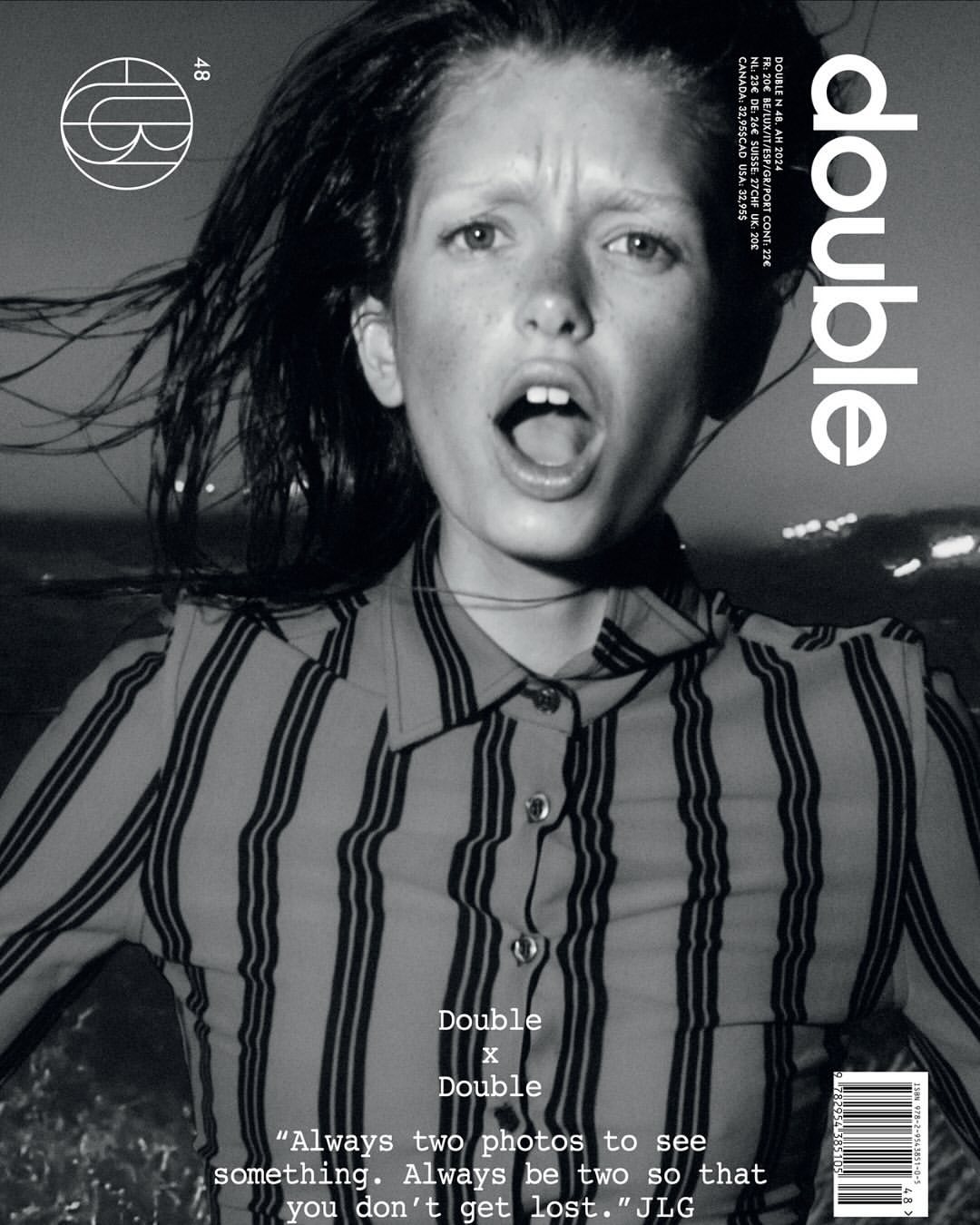 Black-and-white magazine cover featuring a young woman with an open mouth, wearing a striped shirt, against a blurred background.