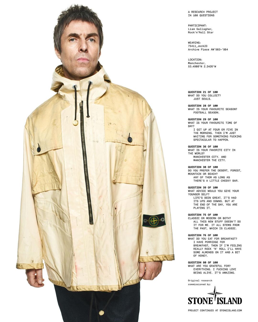 Portrait of Liam Gallagher in a cream-colored hooded jacket, standing against a white backdrop featuring Stone Island text.