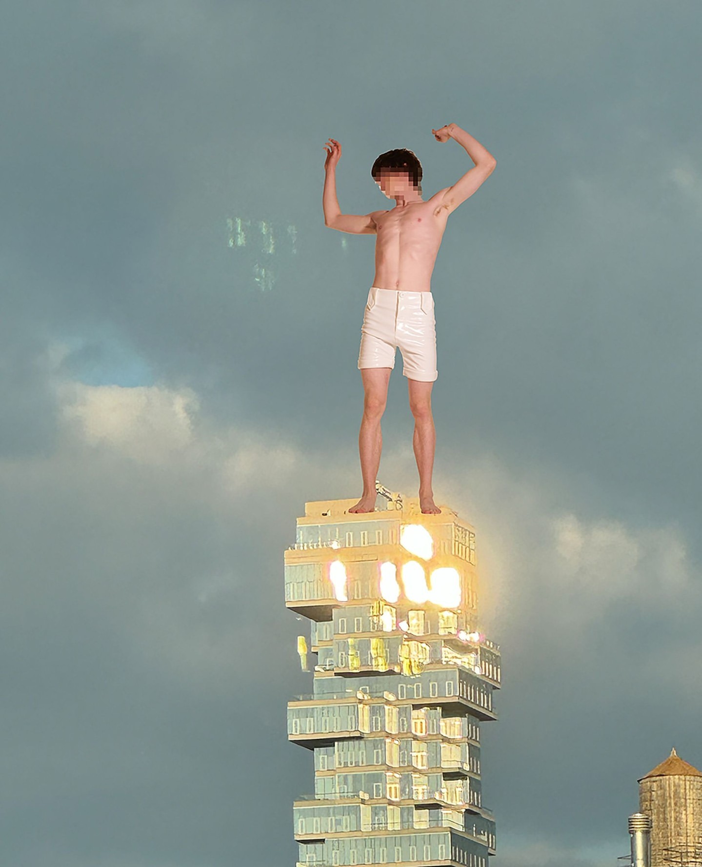 Man standing shirtless atop a skyscraper with arms raised against a cloudy sky; modern architecture and urban setting; golden sunlight highlights.