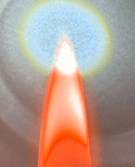 Abstract rendering with an orange tapered form under a blurred blue oval, set against a textured gray background with soft lighting.