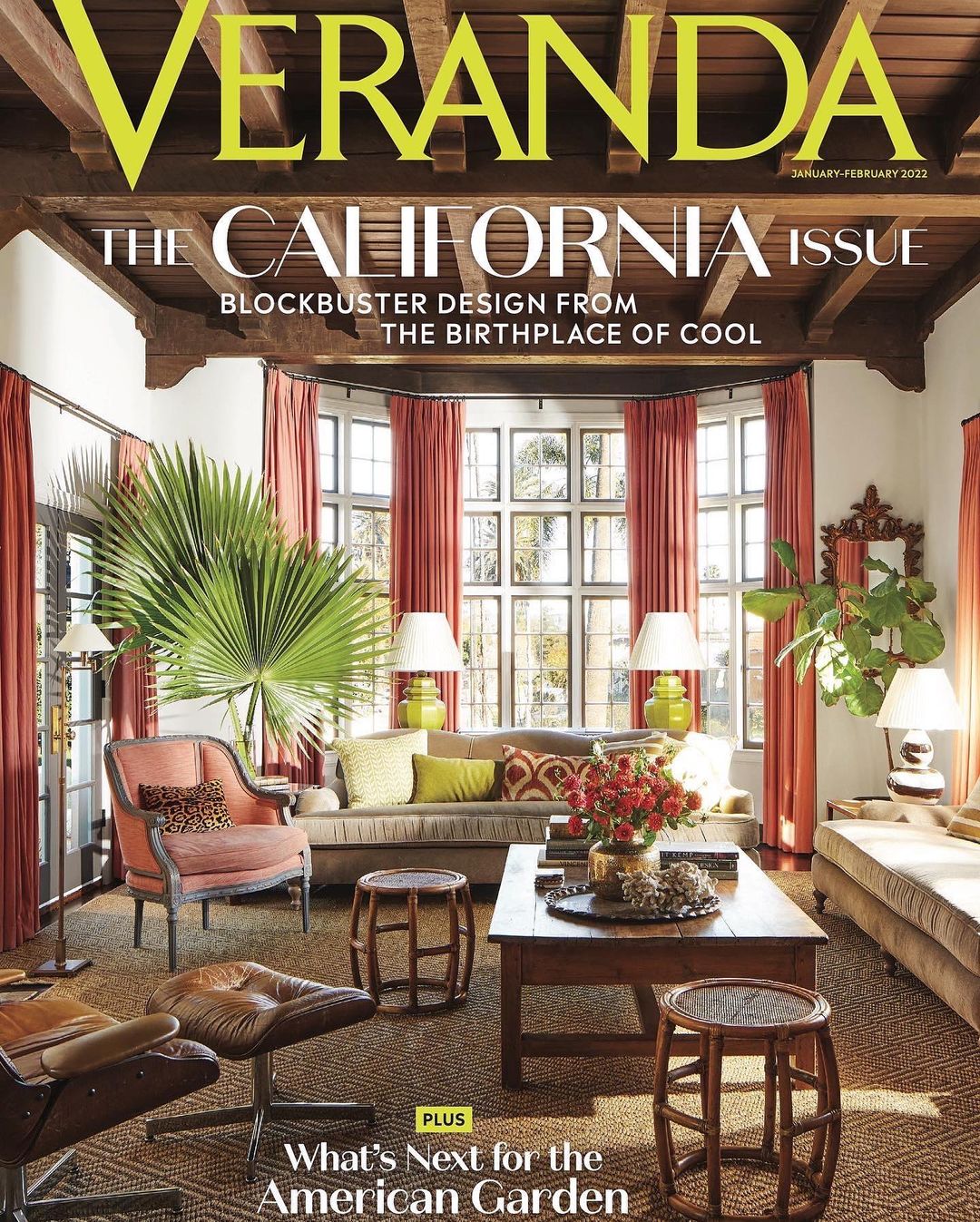 Veranda magazine cover featuring a living room with a beige sofa, chairs, wooden coffee table, lamps, and bay window.