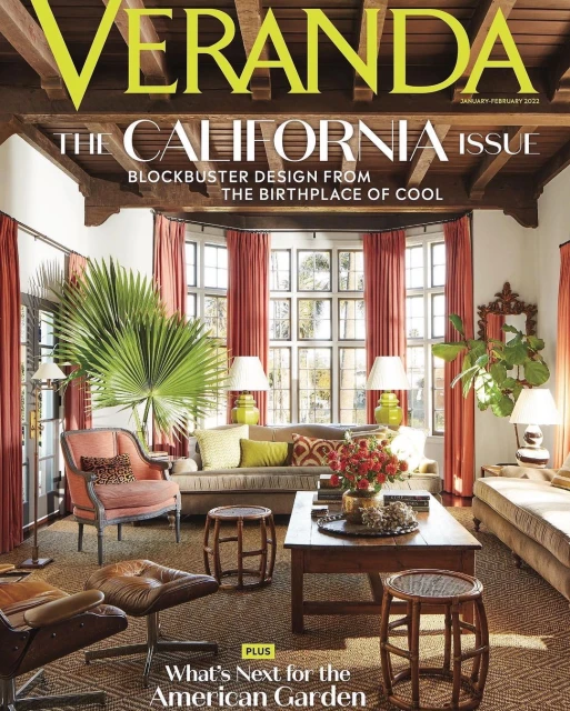 Veranda magazine cover featuring a living room with a beige sofa, chairs, wooden coffee table, lamps, and bay window.