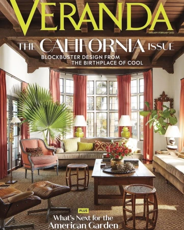 Veranda magazine cover featuring a living room with a beige sofa, chairs, wooden coffee table, lamps, and bay window.