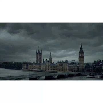 London skyline featuring the Houses of Parliament and Big Ben under a dramatic, cloudy sky, reflecting in the River Thames.
