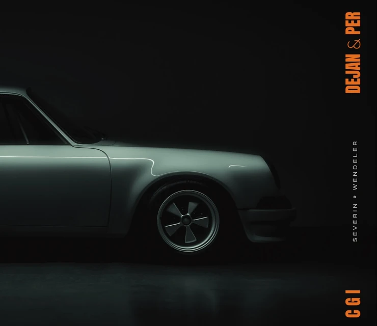 Studio shot of a grey classic Porsche 911 with a black tire and wheel in a studio with black background and orange typography.