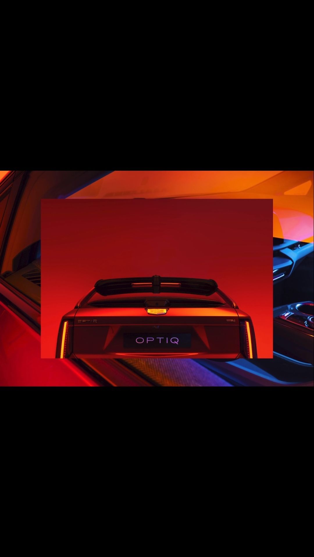 Automotive photography showcases the rear of a futuristic red car with 'OPTIQ' emblem under warm studio lighting. Modern design aesthetic.
