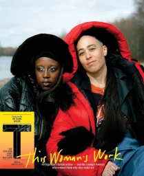 Two women wearing heavy puffer jackets outdoors near water, photographed by Delali Ayivi for a magazine cover.
