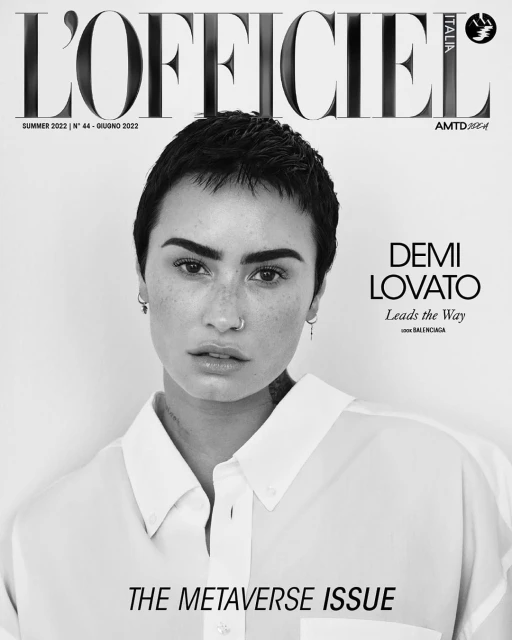Black and white portrait of Demi Lovato on the cover of L'Officiel Italia's The Metaverse Issue, summer 2022, in a button-down shirt.