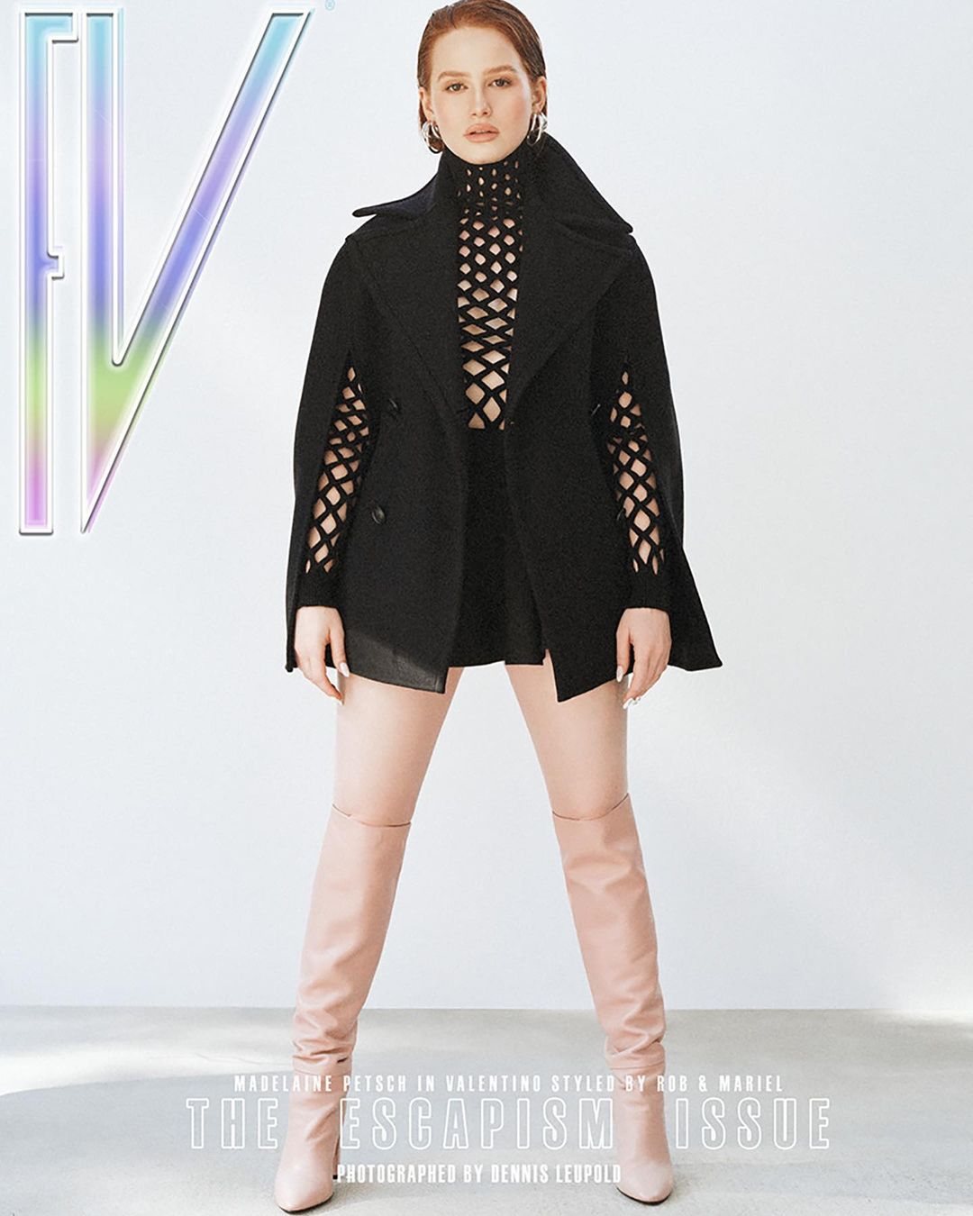 Fashion magazine cover featuring a woman in a black top, black cape jacket, and high boots against a white background.