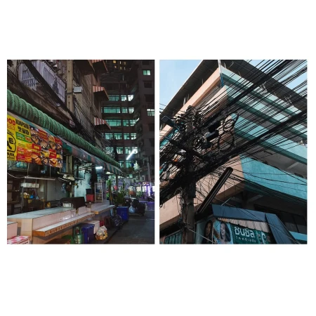 Urban scene featuring a street market stall and a pole with chaotic electric wires, capturing the essence of a bustling city at night.