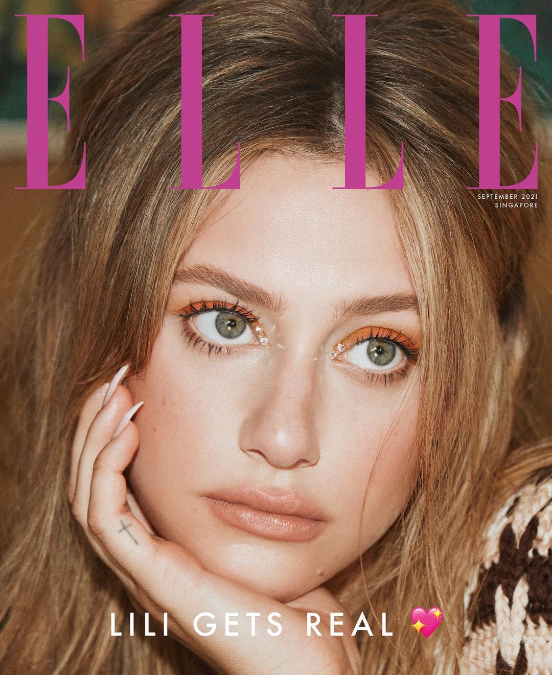 Elle magazine cover featuring model Lili Reinhart with light skin, blonde hair, green eyes, and minimal makeup.