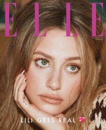 Close-up magazine cover portrait of a blonde woman with warm eye makeup resting her chin on her hand, photographed by Dennis Leupold