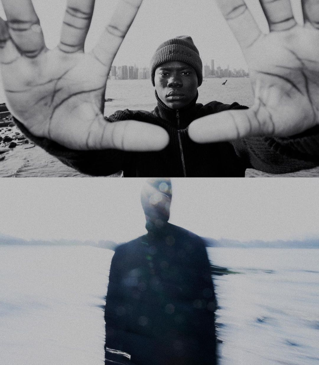 Monochrome portrait of a Black man in beanie, framed by hands against a blurred city backdrop. A second blurred figure below.