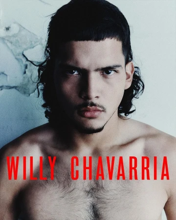 Portrait of a shirtless adult male with dark hair and a serious expression, against a textured off-white background and red text overlay.