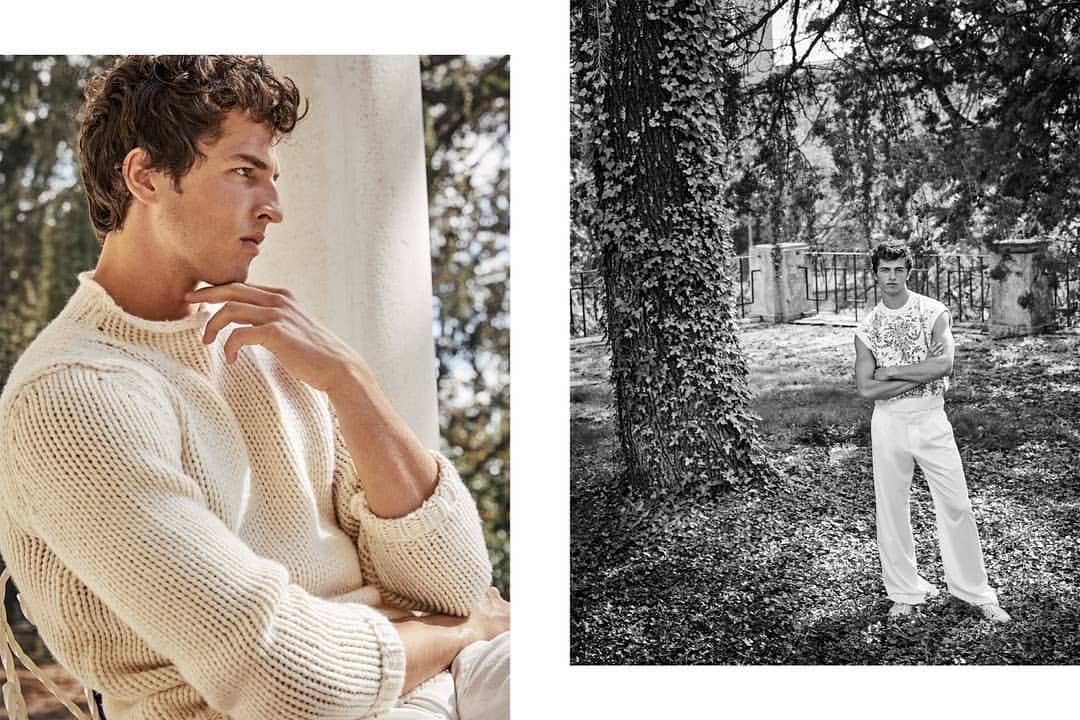 Two-part fashion editorial contrasts a curly-haired male model wearing a chunky knit sweater indoors and a monochrome outdoor portrait.