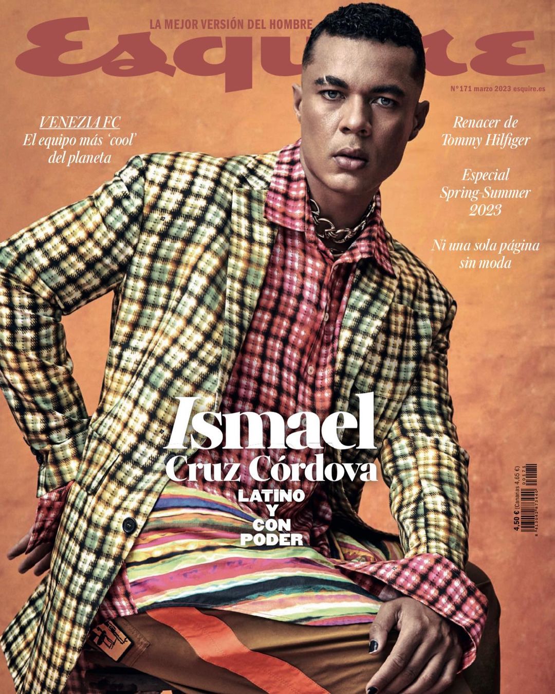 Magazine cover featuring Ismael Cruz Cordova in a patterned blazer and colorful shirt, set against a muted orange background with 'Esquire' logo.