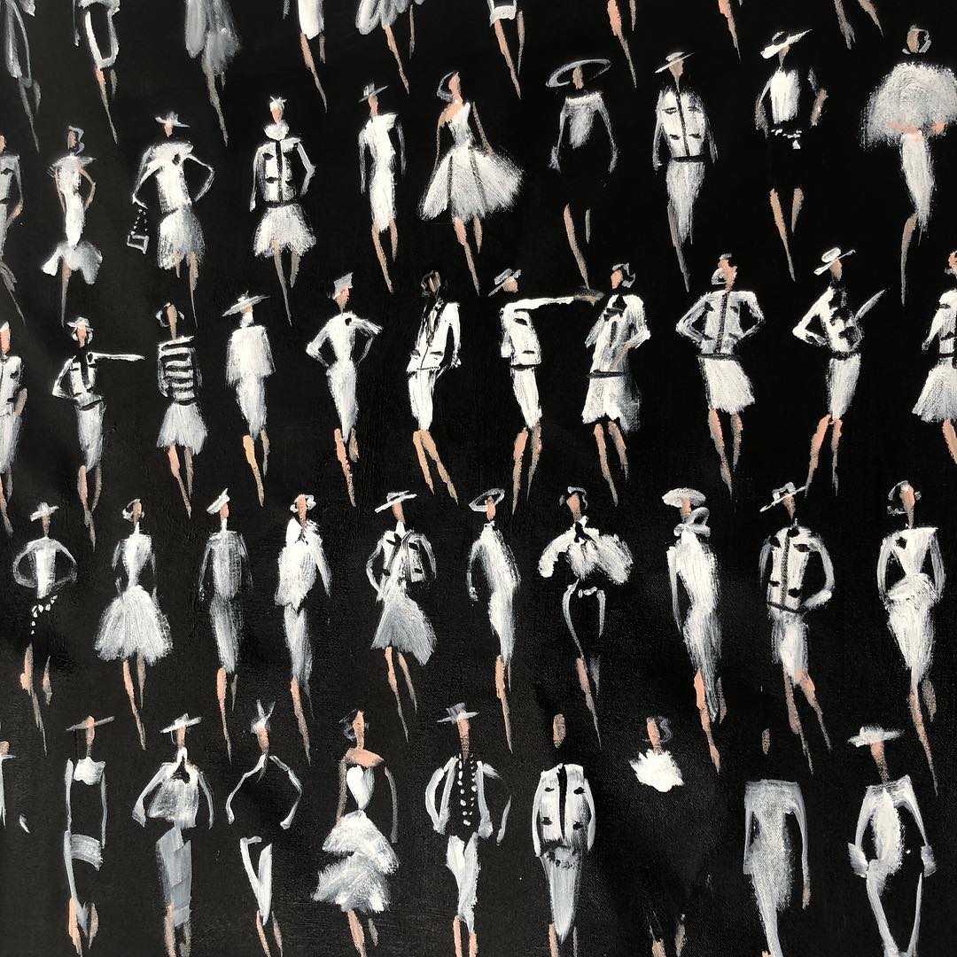 Artistic rendering of numerous figures in black and white, creating a dynamic pattern reminiscent of fashion illustrations on black canvas.