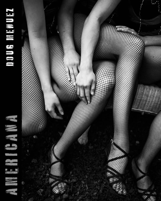 Monochrome photograph showcasing the legs and arms of three women wearing fishnet stockings and strappy heels, with focus on texture and pattern.