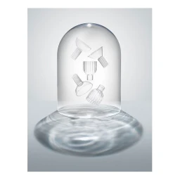Glass cloche enclosing floating fluted glassware over a rippled water shadow on a seamless white studio background