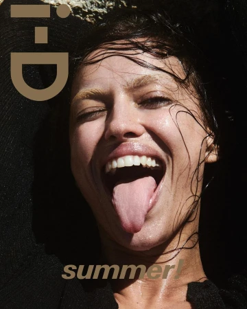 Close-up portrait of a woman with wet hair sticking out her tongue, photographed by Drew Vickers.