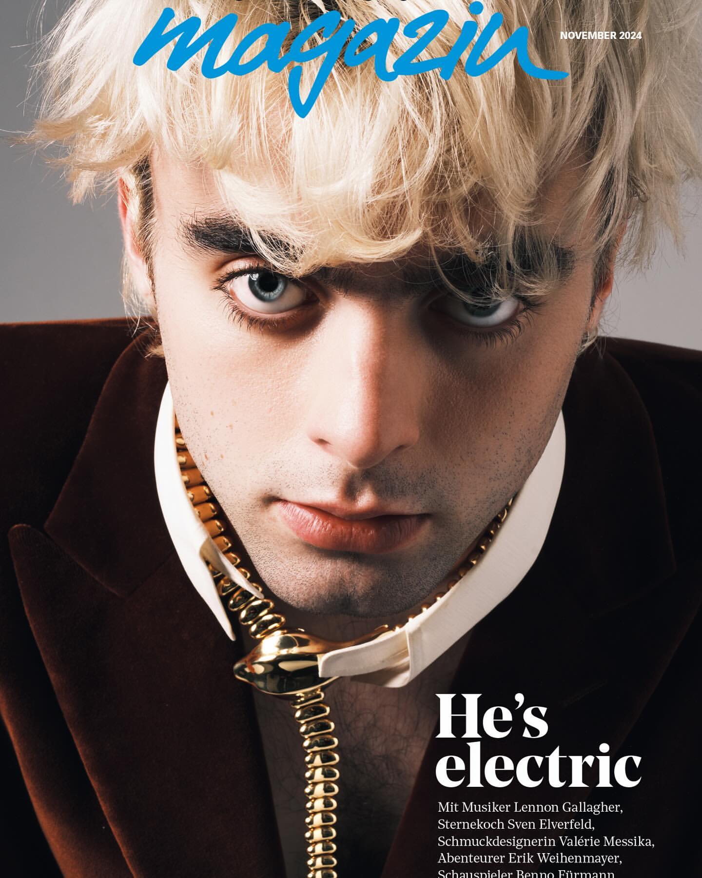 Magazine cover featuring a close-up of a young adult with blond hair, wearing a brown jacket and decorative gold snake chain.