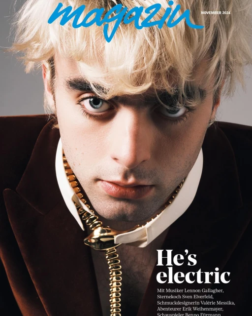 Magazine cover featuring a close-up of a young adult with blond hair, wearing a brown jacket and decorative gold snake chain.