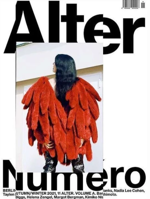 Magazine cover featuring a person in a red, feathery coat. The words Alter and Numero are in bold black print around the central image.