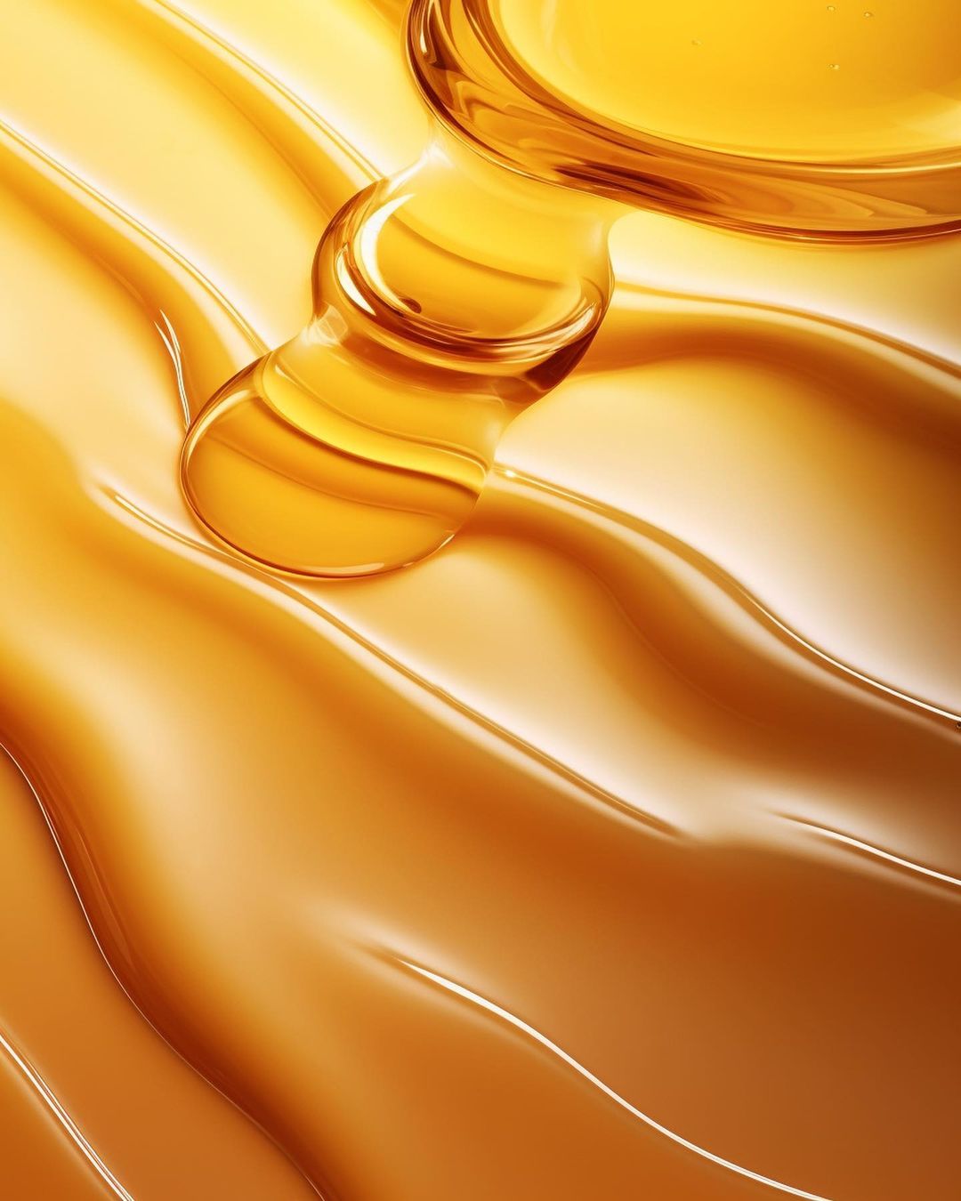 Close-up of viscous liquid, glossy liquid cascade, amber-colored fluid motion creating smooth wavy patterns on a reflective surface.