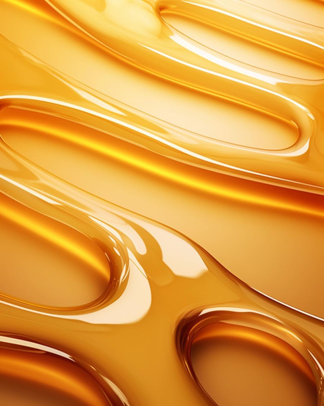 Abstract close-up of golden translucent liquid forming curved, organic shapes with smooth textures and a warm, inviting appearance.