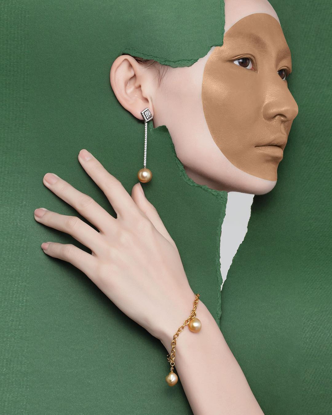 Asian woman's profile with gold pearl jewelry, dramatic paper tear effect, and warm lighting for a fashion-forward and elegant aesthetic.