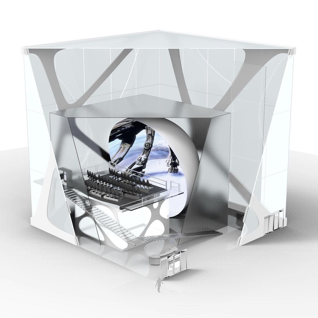 Architectural rendering of a futuristic theater inside a cube-shaped structure with stairs, seating, a large screen, and a miniature human figure.