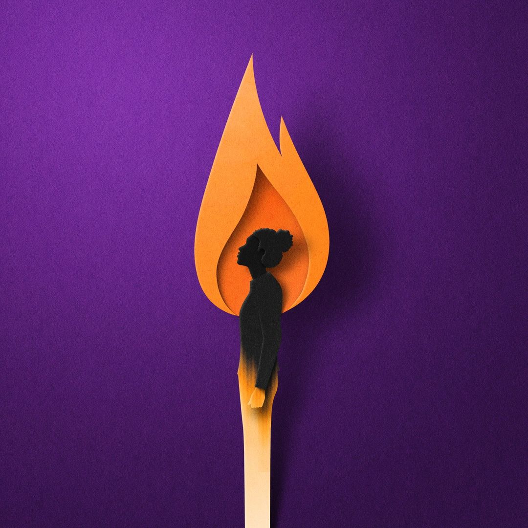 Paper art of a burning match with a silhouette of a woman's head and upper body inside the flame on a purple background.
