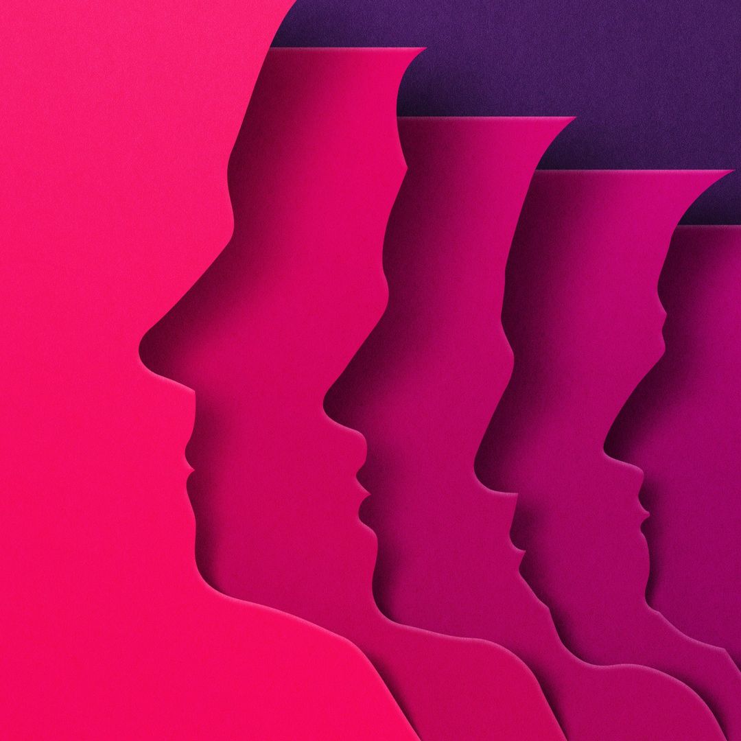 Abstract paper art of human face profiles in shades of magenta and purple, creating a visually layered and dimensional effect.