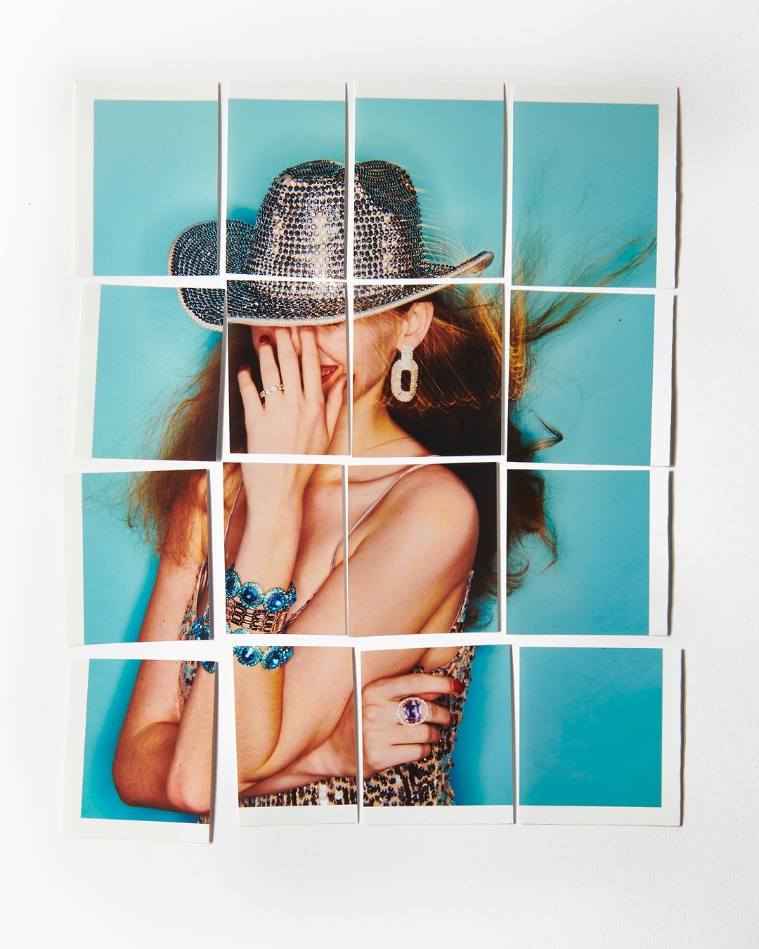 Artistic composition of a fashion model with red hair and a sequined hat on a blue background, presented as a fragmented photo collage.