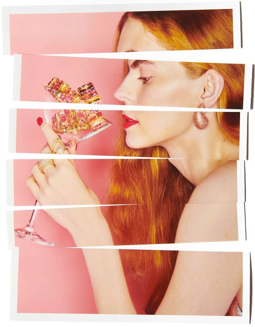 Conceptual fashion shot featuring a woman with red hair holding a cocktail in a pink setting with a deconstructed editorial design.