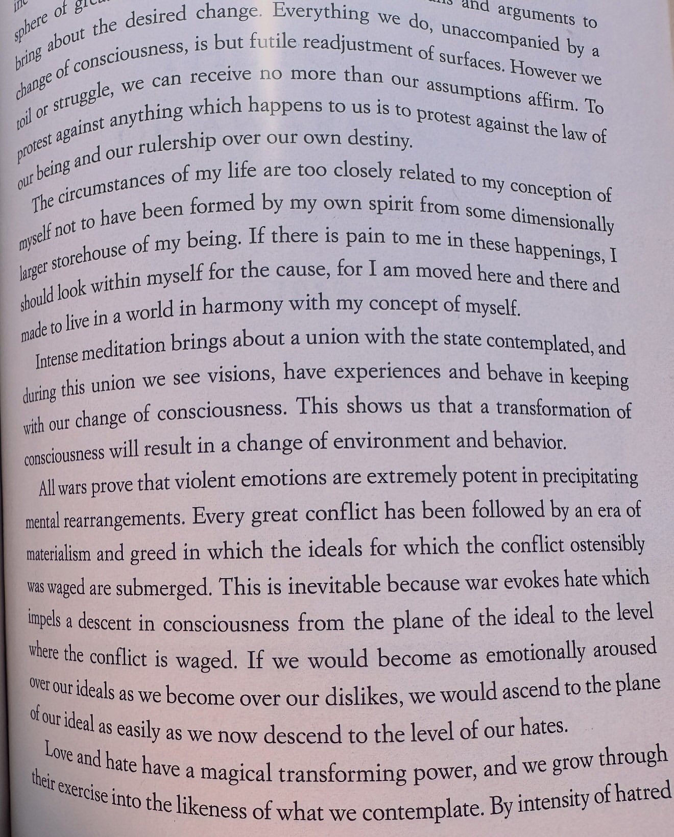 Open book page filled with dense text, illuminated by soft lighting, creating a scholarly and focused atmosphere for reading.