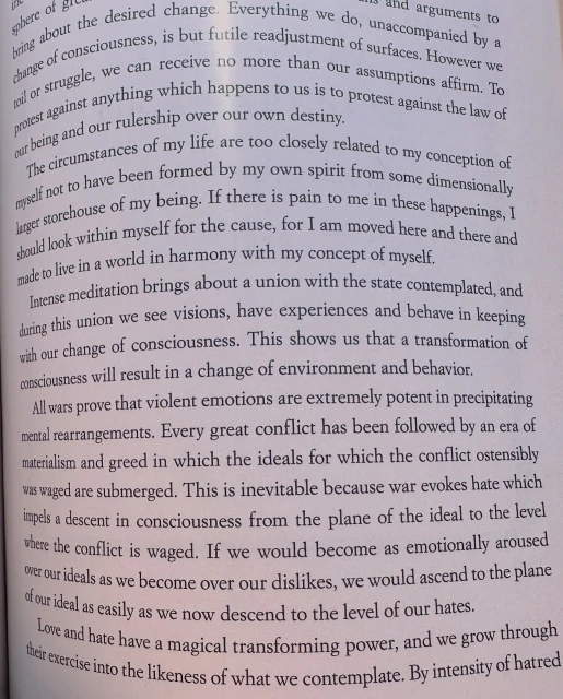Open book page filled with dense text, illuminated by soft lighting, creating a scholarly and focused atmosphere for reading.