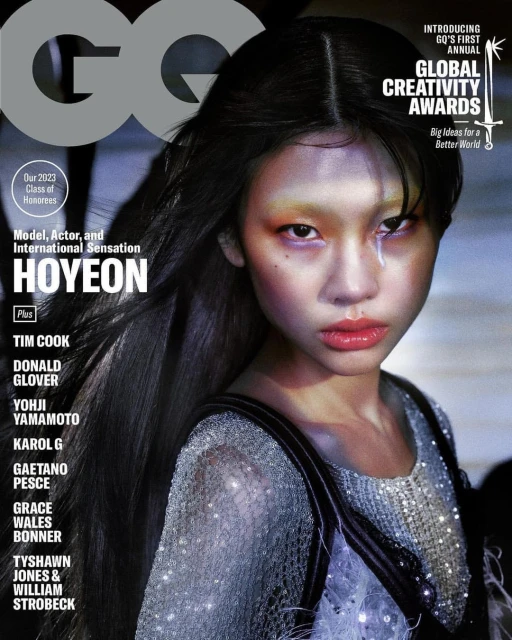 GQ magazine cover featuring model Hoyeon with dark hair and eye-catching makeup, showcasing a close-up shot with vibrant colors and bold typography.