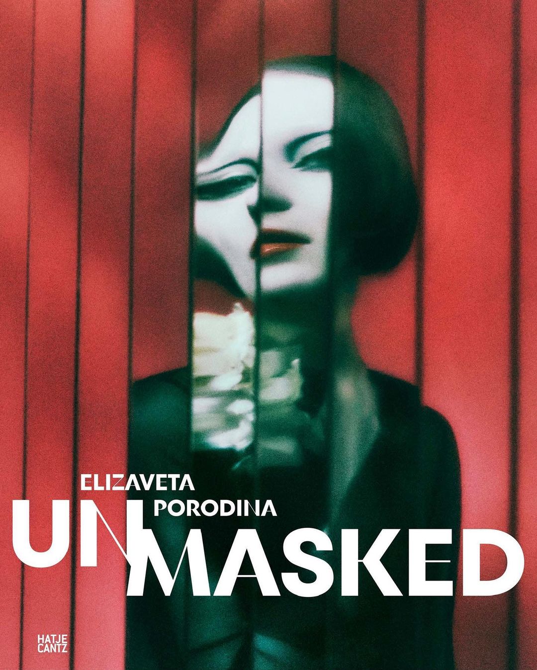 Abstract portrait of a woman with dramatic makeup, split and obscured by vertical red bars, creating an artistic, distorted effect.