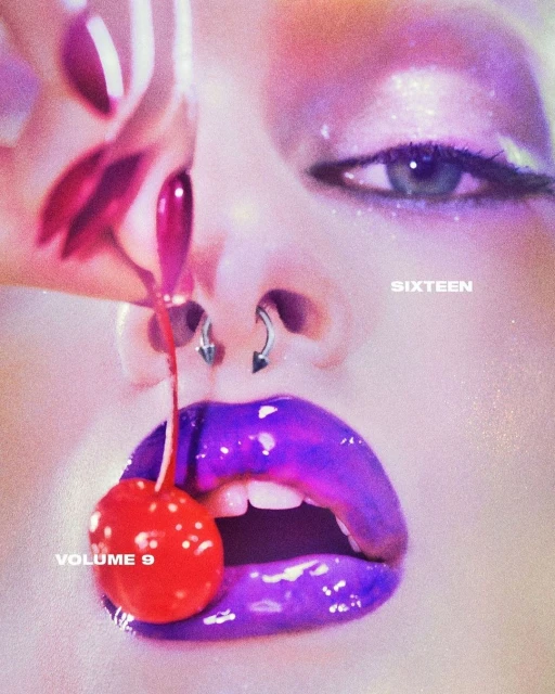 Close-up of a woman's face with vibrant purple lips, nose piercings, and a red cherry dangling from her mouth, creating a surreal aesthetic.