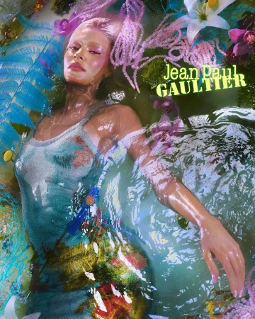 A woman submerged in water, surrounded by vibrant flora and pink beads, photographed by Elizaveta Porodina in London.