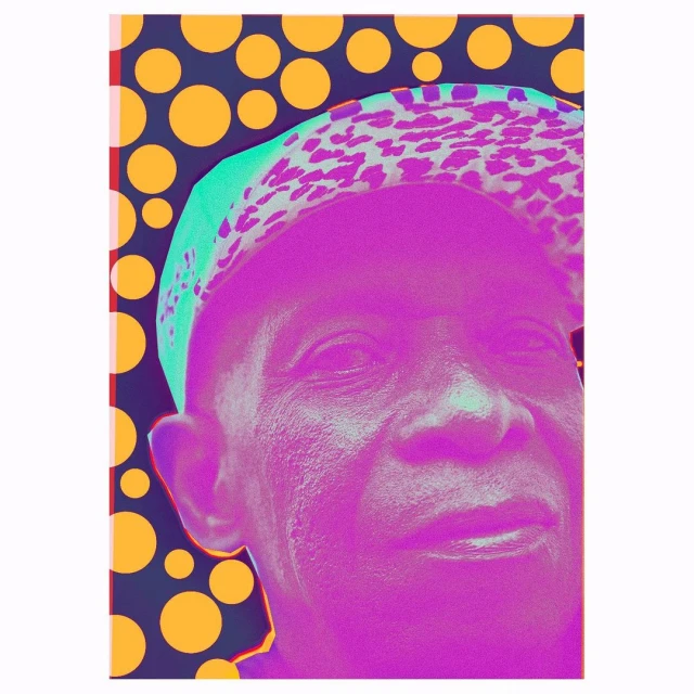 Close-up portrait of an adult man with vivid purple skin, wearing a patterned cap against a background of bold orange polka dots.