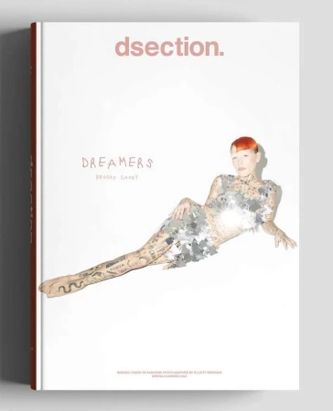 Magazine cover featuring Brooke Candy wearing a mirrored top and skirt against a solid white background.