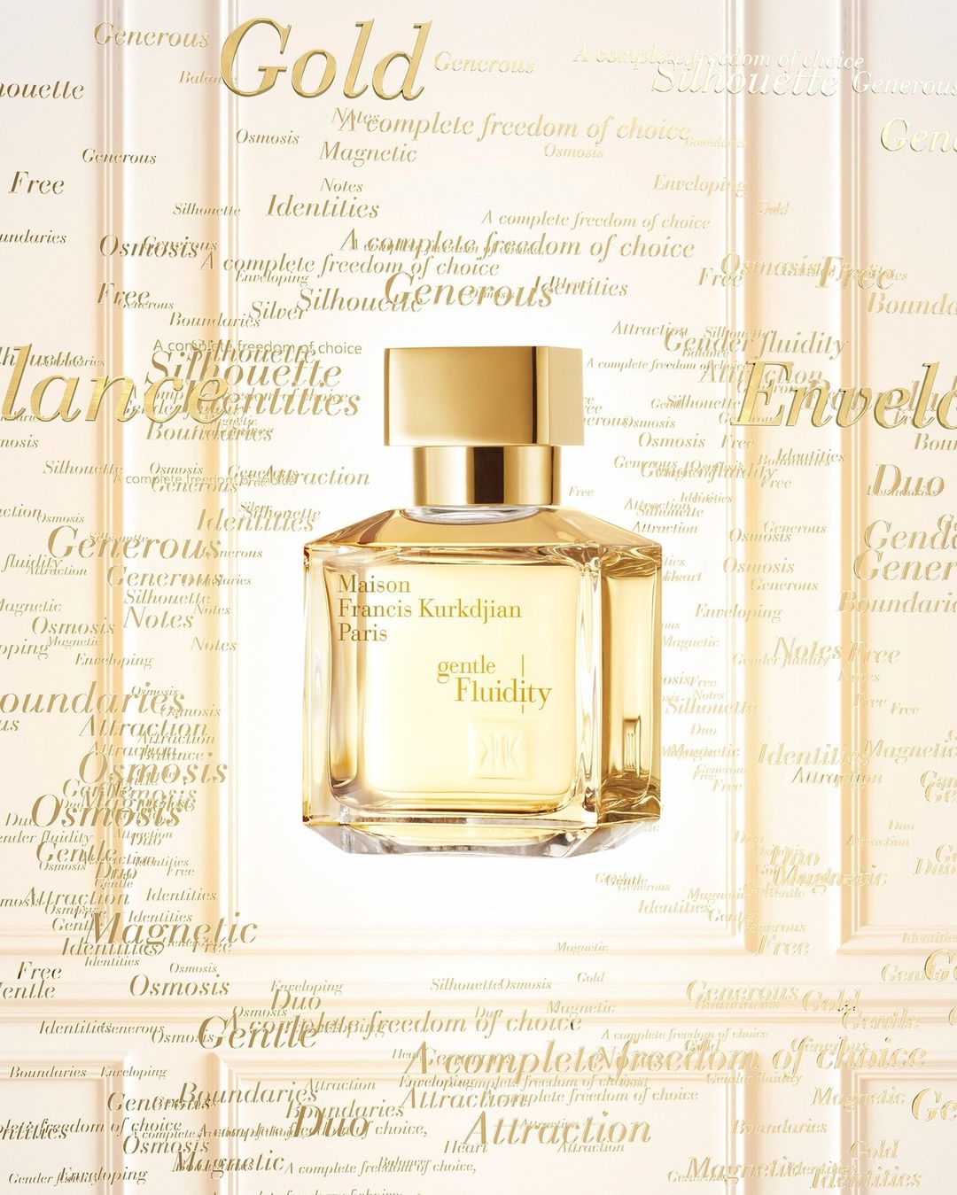 Elegant still life shot of Maison Francis Kurkdjian Paris 'gentle Fluidity' perfume bottle against a background of gold lettering.