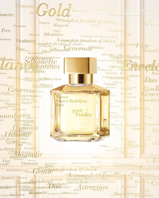 Elegant still life shot of Maison Francis Kurkdjian Paris 'gentle Fluidity' perfume bottle against a background of gold lettering.