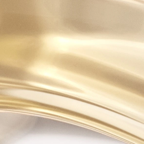 Close-up of shimmering gold fabric with soft, rippled texture and elegant folds, creating a luxurious and smooth aesthetic.