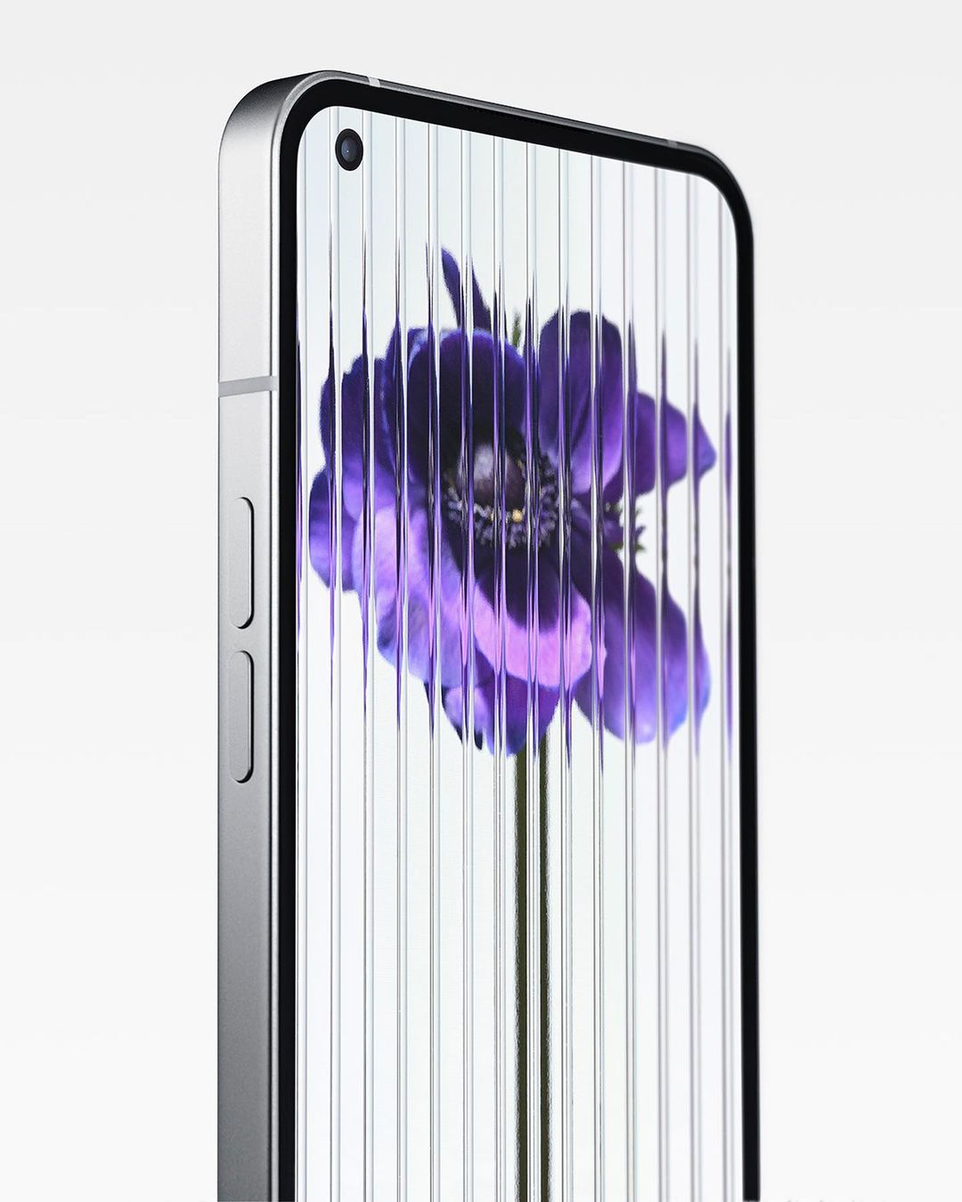Nothing Phone (1) shown in a studio shot, showcasing its sleek design, metallic frame, and purple flower wallpaper on the screen.