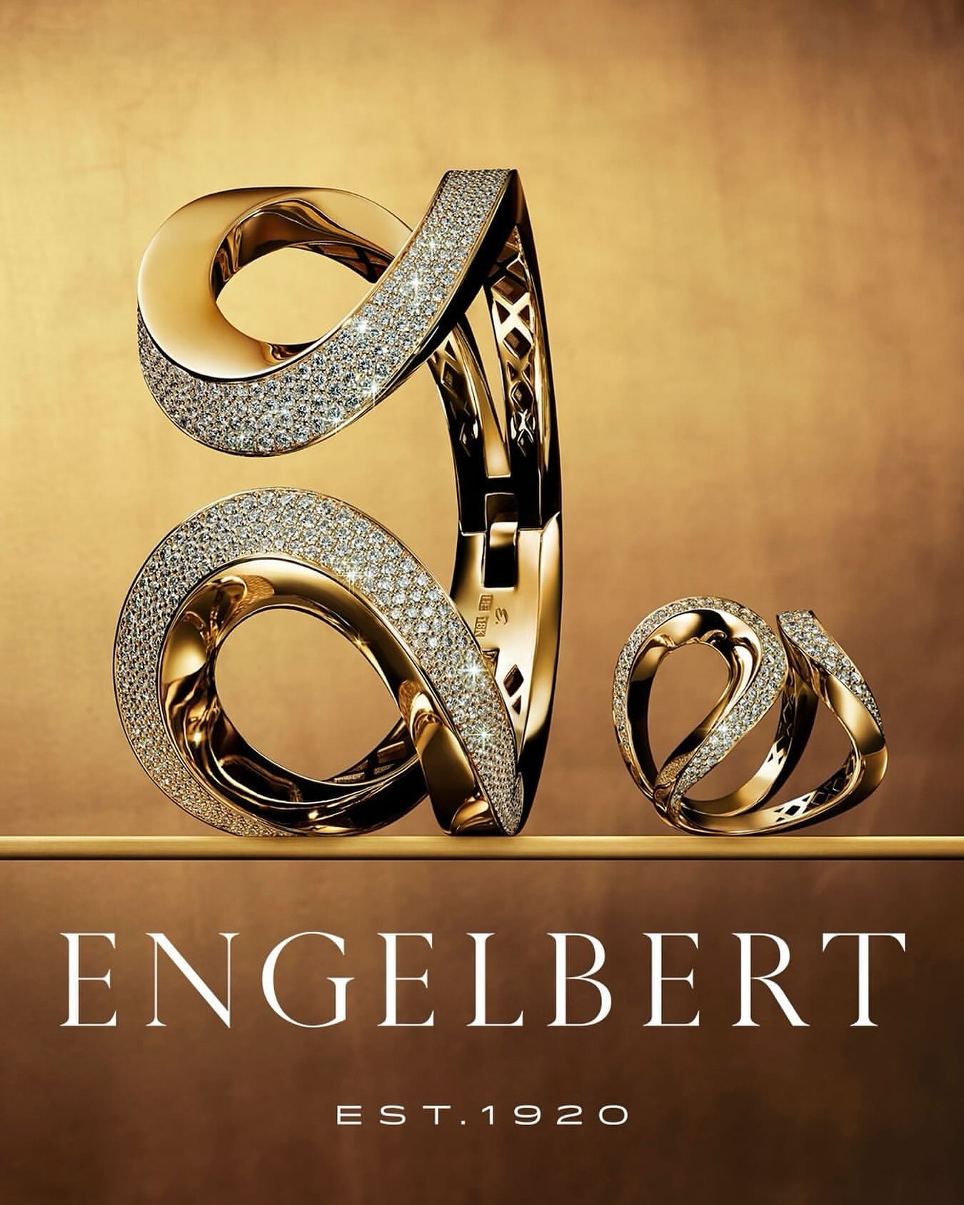 Elegant Engelbert jewelry: a gold and diamond encrusted bracelet and ring set against a luxurious gold background.