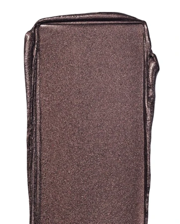 Close-up of shimmering bronze-colored makeup swatch, capturing its reflective texture and rich pigment on a white backdrop.
